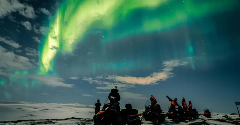 From Alta: Northern Lights Night Adventure By Snowmobile — snowmobile tour in Alta