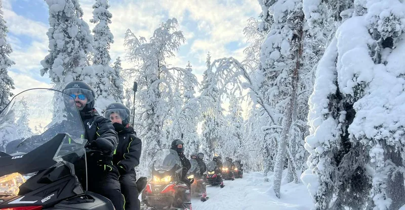 Snowmobile Safari In Snowy Forest — snowmobile tour in Levi